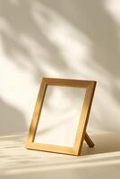 Elegant wooden frame for wall art mockup stands on a table with soft shadows and light creating a serene ambiance in a minimalist setting during daylight photo