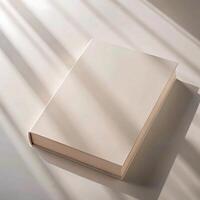 Blank Book Mockup in Soft Sunlight with Subtle Shadows photo