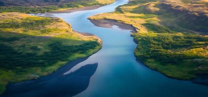 An aerial view of a river flowing through a valley photo