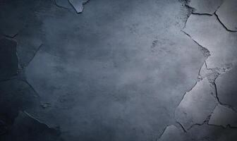 Dark gray textured concrete surface with cracks. photo