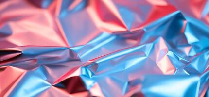 Abstract blue and pink crumpled foil texture. photo