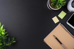 Minimalist workspace with notebook, sticky notes, plant, and tablet. photo