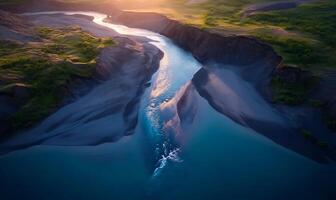Aerial view of a river splitting into two channels at sunset. photo