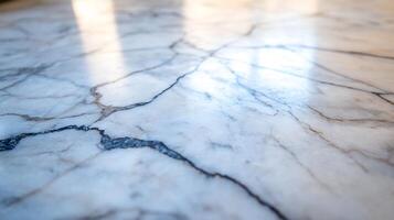 Close-up of white marble surface with cracks and light reflections. photo