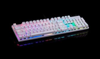 White RGB mechanical keyboard with colorful backlighting on black background. photo