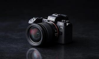 Black mirrorless camera with lens on dark surface. photo