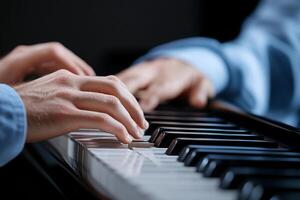 Close-up of hands playing piano duet. photo