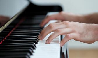 Close-up of hands playing a piano. photo