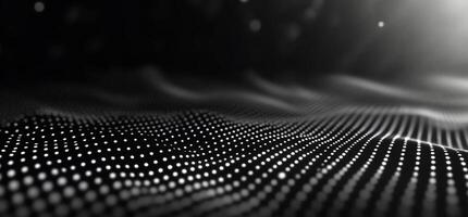 Abstract grayscale wave of glowing dots. photo