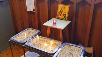 three small containers with candles on them photo