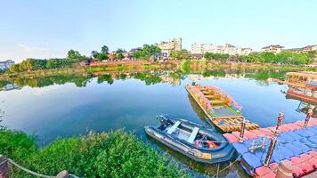 a boat is docked on the water next to a house photo