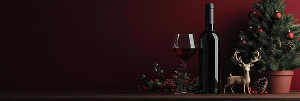 A bottle of red wine, a glass, and a deer decoration next to it, a Christmas tree in a pot on dark red background photo