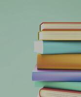 Colorful books on a light green background photo