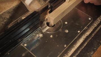 Sawing a wooden block on a machine video