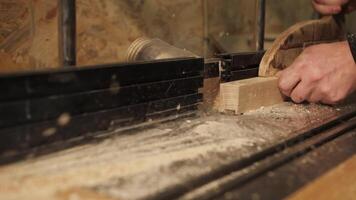 Sawing a wooden block on a machine video