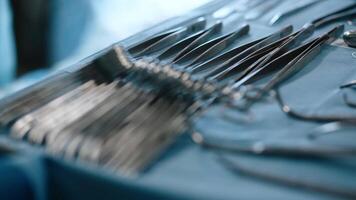 Close-up of medical instruments placed on the operating table in the operating room. Healthcare and medicine concept, surgery video