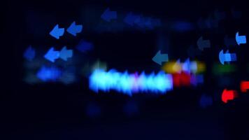 Night lights in abstract patterns. Colorful lights illuminate a dark urban environment, forming abstract shapes and patterns that dance in the night. video