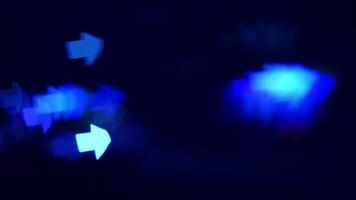 Blue lights on dark bg. Blue light indicators shine brightly against a dark background, creating a striking visual contrast with movement. video