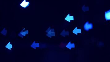Abstract blue arrow lights. Bright blue lights shaped like arrows illuminate the dark space, creating an abstract visual effect and atmosphere. video