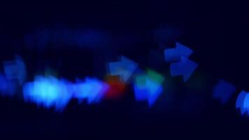 Nighttime blue arrows pointing. Blue and green arrows form a vibrant, abstract design, evoking movement in a nighttime scene. video