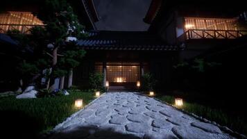 Night view of a traditional Japanese shoguns residence illuminated by lanterns video