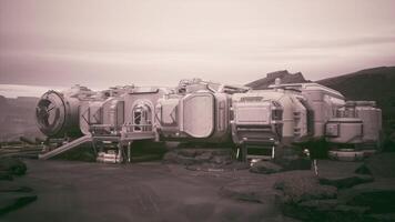 Colonist base on a distant planet with futuristic structures and rocky terrain video