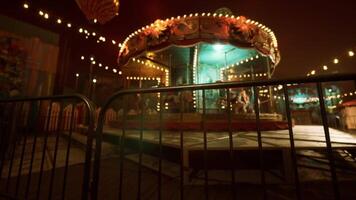 A deserted amusement park at night featuring a quiet carousel and dim lights video