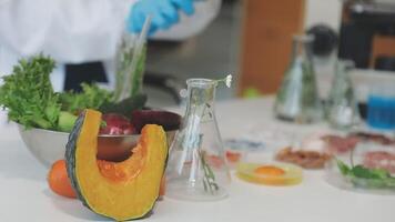 A person in a lab coat is holding a bowl of vegetables video