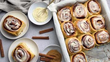 Freshly baked cinnamon rolls covered with icing video