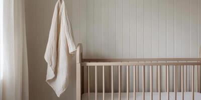 Tranquil nursery with neutral wooden crib and soft lighting for baby room decor inspiration photo
