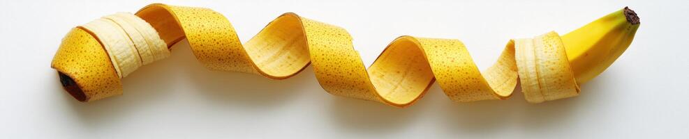 Creative fun shot of a banana peel curled artistically for design and decoration photo