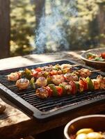 Rustic outdoor barbecue with grilled skewers in a forest setting photo
