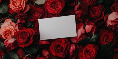 Dreamy floral composition with romantic red roses and blank card for special occasions photo