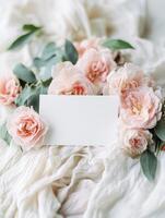 Elegant floral arrangement with delicate pink roses and blank card for romantic occasions photo