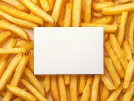 Blank card surrounded by golden french fries for restaurant promotion or menu design photo
