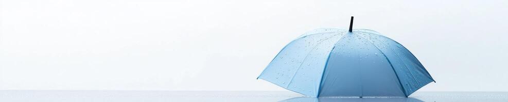 Modern minimalist design with pastel blue umbrella featuring subtle raindrop accents on light background photo
