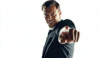 Confident businessman smiling and pointing directly at viewer photo