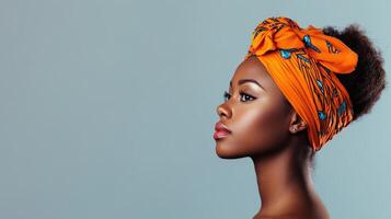 African Woman Profile Portrait With Orange Headwrap photo