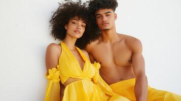 Young Couple Posing Together In Yellow Attire photo