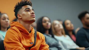 Young Man Attentively Listening In A Classroom Setting photo