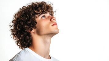 Young Man With Curly Brown Hair Looking Upward photo