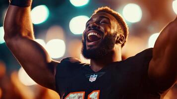 A jubilant football player celebrates victory under stadium lights photo