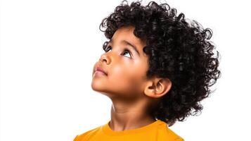 Young Boy with Curly Hair Looks Upward photo
