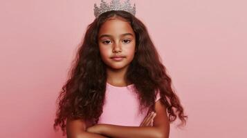 Young Girl Wearing A Sparkling Crown Pink Background photo