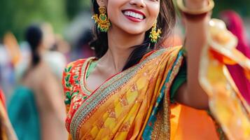 Woman Smiling In Vibrant Orange And Red Sari photo