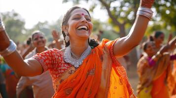 A Woman Joyfully Dances In An Orange Sari photo