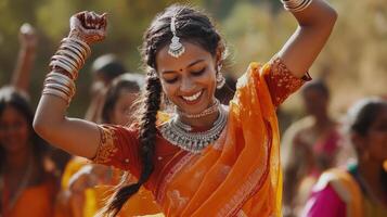 Young Woman Dances in Vibrant Orange Sari photo