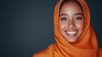 Woman Wearing Orange Hijab Smiling Brightly photo