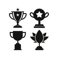 Four solid black silhouette trophy icons on a white background. vector