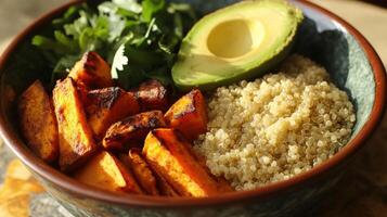 Roasted Sweet Potato Quinoa Bowl with Avocado and Cilantro photo